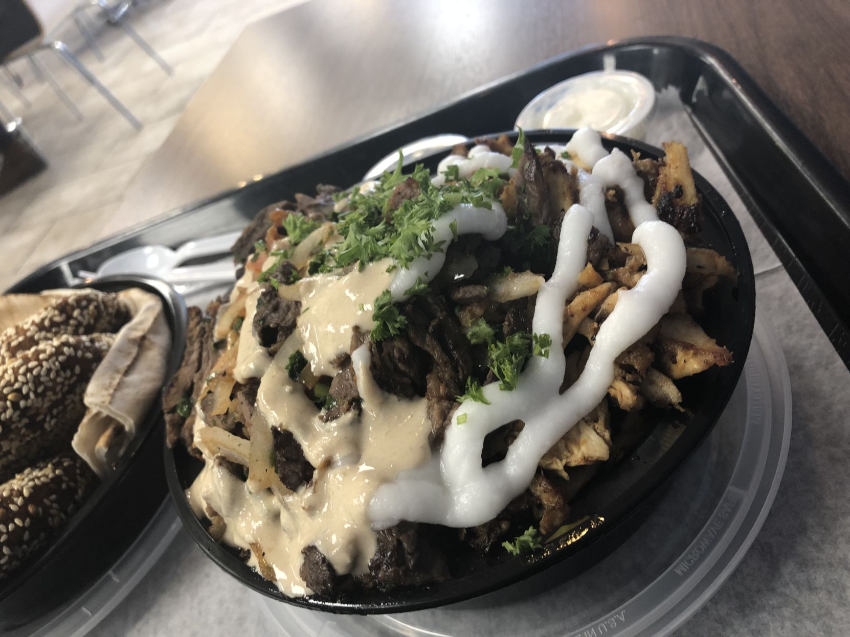Chicken and beef shawarma with garlic and tzatziki sauce.